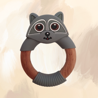 A grey silicone teething ring designed to resemble a raccoon, with a wooden central ring.