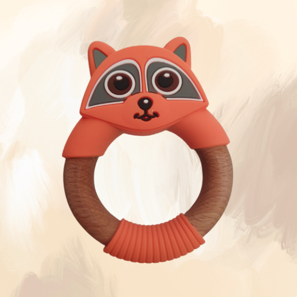 A silicone teething ring designed to resemble a raccoon, with a combination of orange and brown colors, and a wooden central ring.