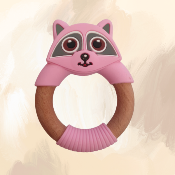 A pink silicone teething ring designed to resemble a raccoon, with a wooden central ring.