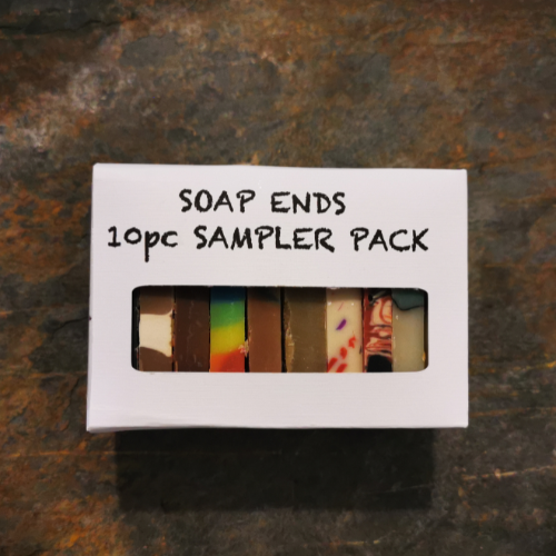A gift pack of 10 soap ends samplers in a white gift pack with an open window to see all the colours