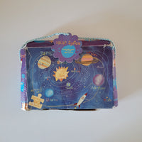 Children's puzzle box about the solar system on a plain background