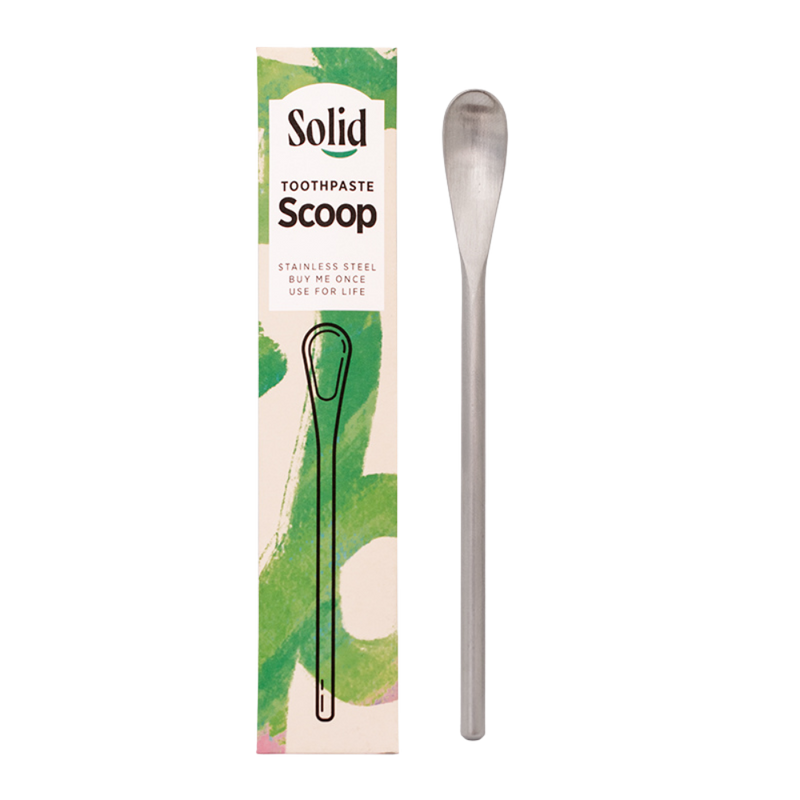 Solid Toothpaste Scoop with packaging on a white background