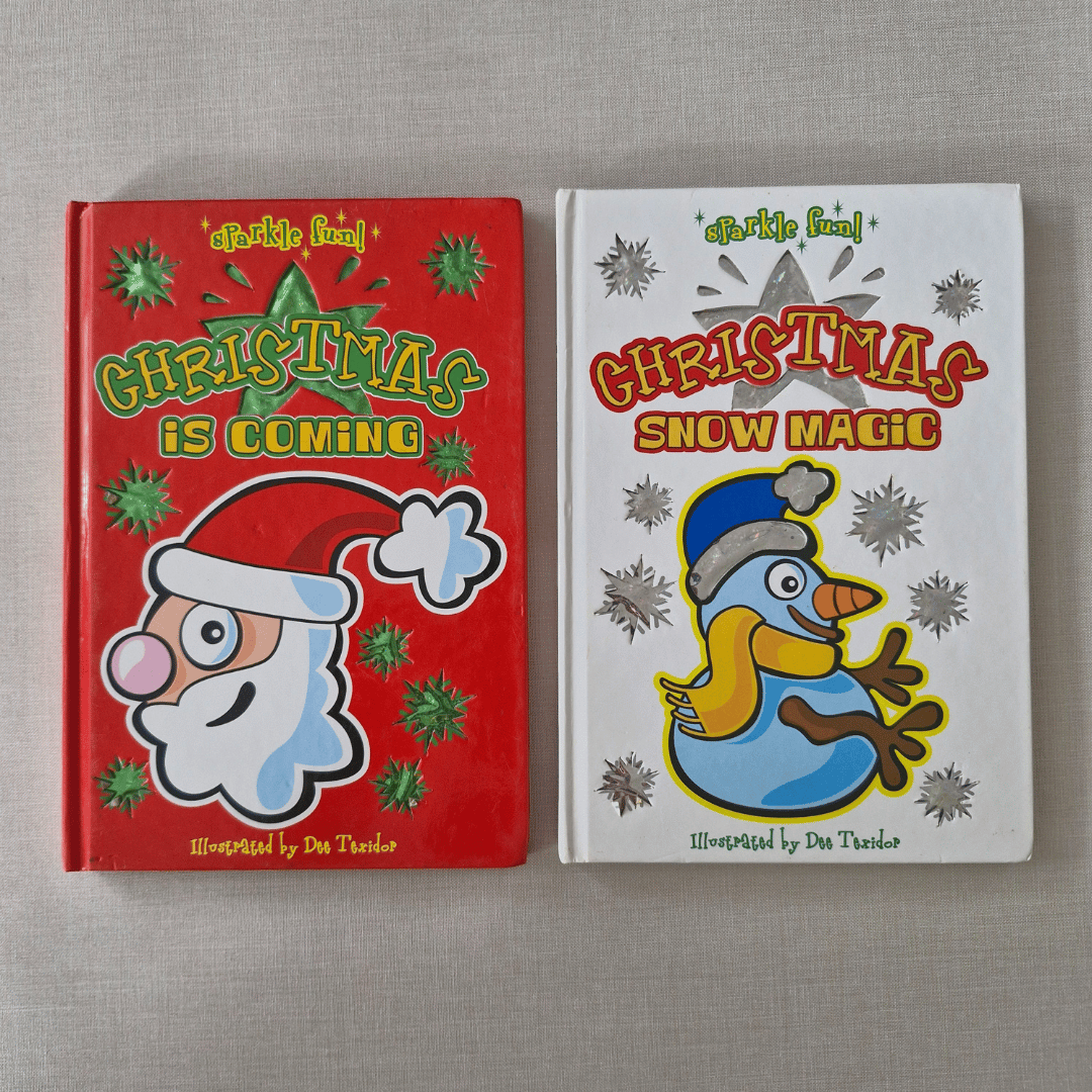 Two Christmas-themed children's books on a grey surface
