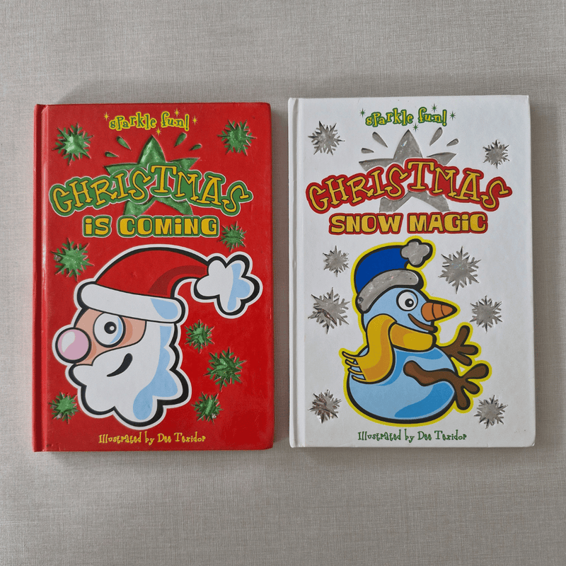 Two Christmas-themed children's books on a grey surface