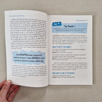 Open book with educational content on a textured surface