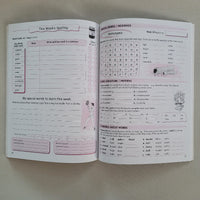Open book with educational content on a plain background