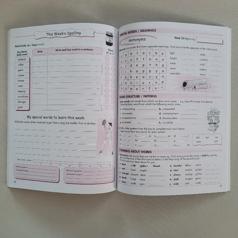 Open book with educational content on a plain background