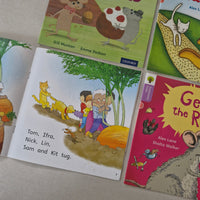 Children's books on a surface with colourful illustrations