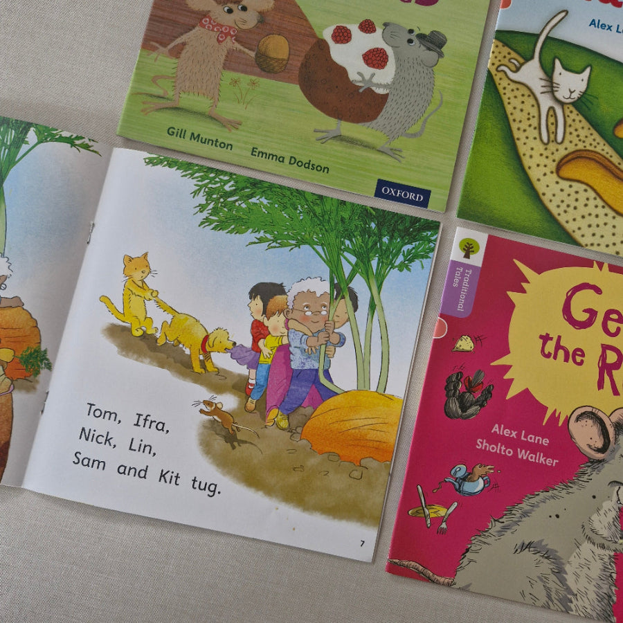 Children's books on a surface with colourful illustrations