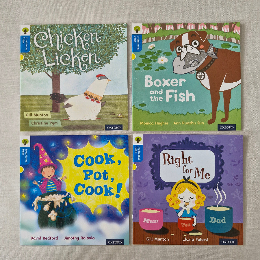 Four children's books with colourful covers on a beige surface