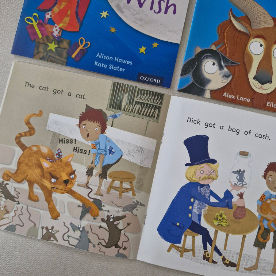 Collection of children's books with illustrated pages featuring animals and text.