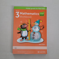 Mathematics workbook for Year 3 on a gray background