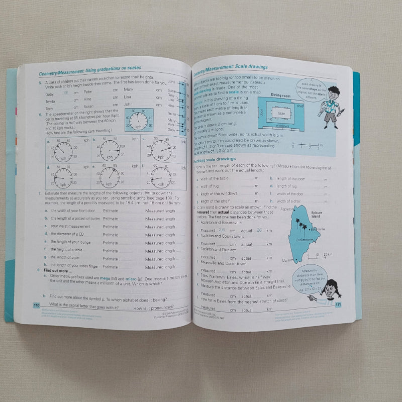 Open book with text and illustrations on a plain background