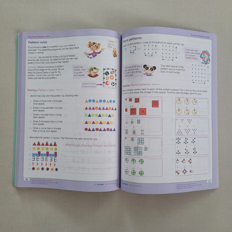 Open book with patterned maths exercises on a plain background
