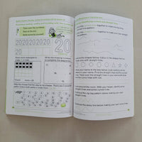 Open book with mathematics educational content on a plain background
