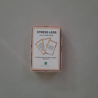 Product packaging with 'Stress Less' text on a neutral background