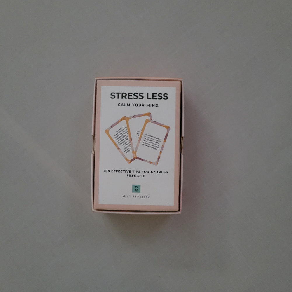 Product packaging with 'Stress Less' text on a neutral background