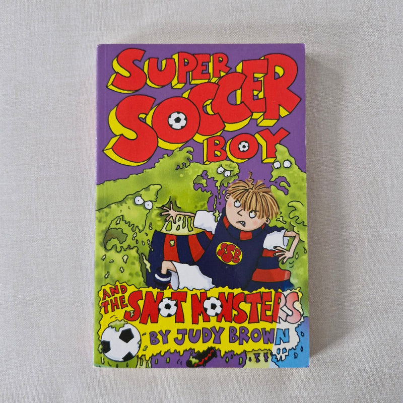 Children's book cover featuring a soccer player and monsters on a purple background