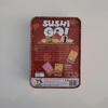 Sushi Go! card game packaging on a grey background