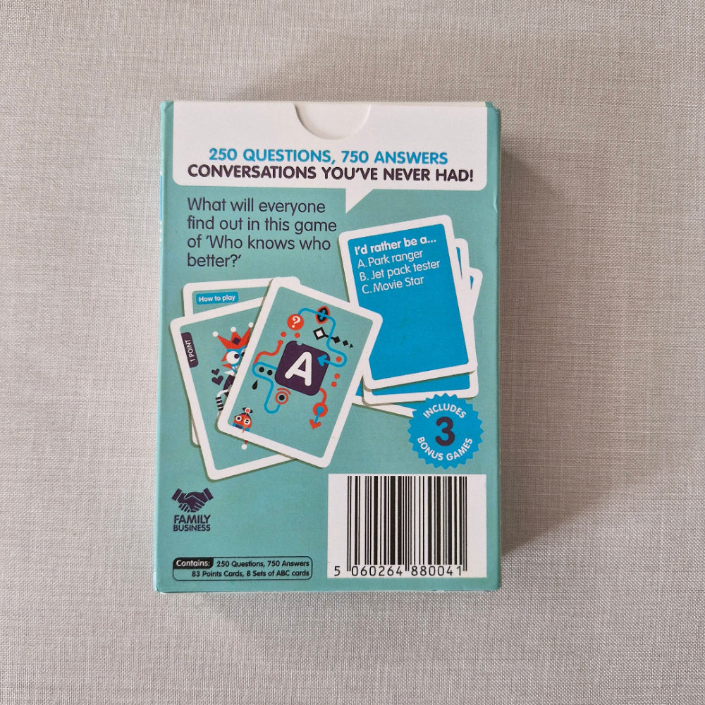 Card game packaging with cards on a textured surface