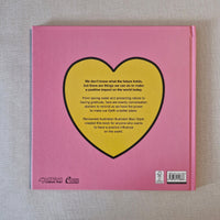 Back cover of a book with a yellow heart-shaped design on a pink background