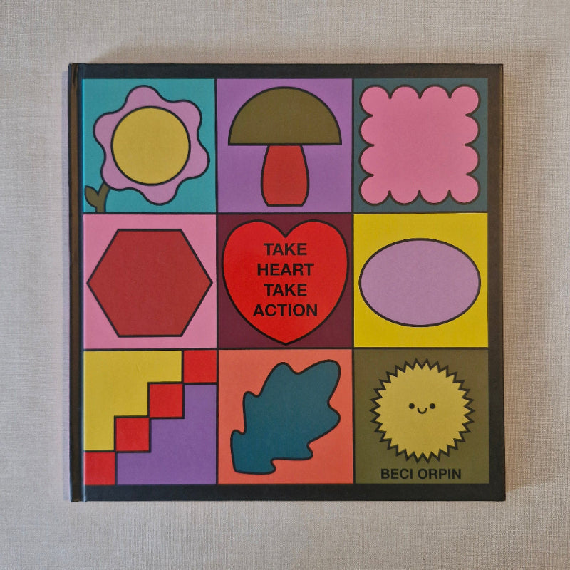 Colorful book cover with geometric shapes and text on a textured surface