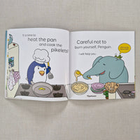 Open book with cartoon illustrations of an elephant and penguin on a textured surface
