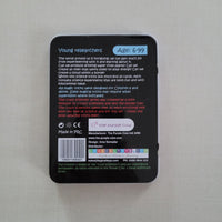 Black rectangular tin with text and labels on a light gray background