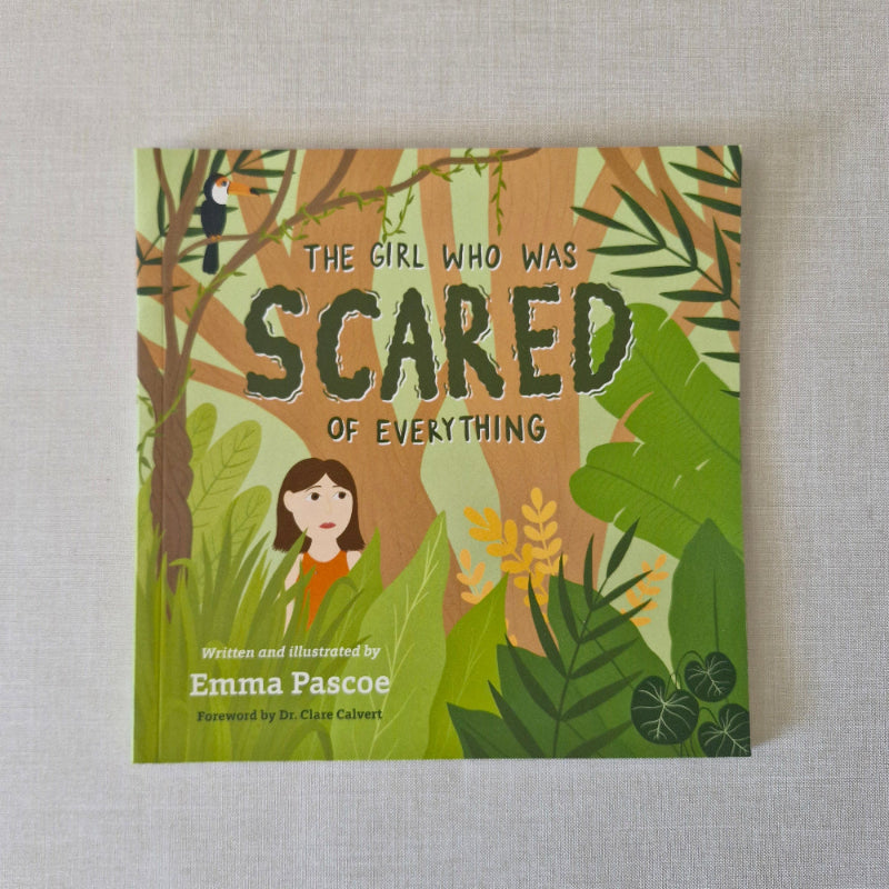 Book cover of 'The Girl Who Was Scared of Everything' with a jungle-themed design on a gray background.