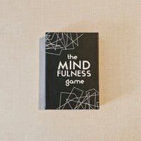 Box of 'The Mindfulness Game' on a beige surface