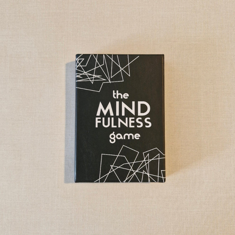 Box of 'The Mindfulness Game' on a beige surface