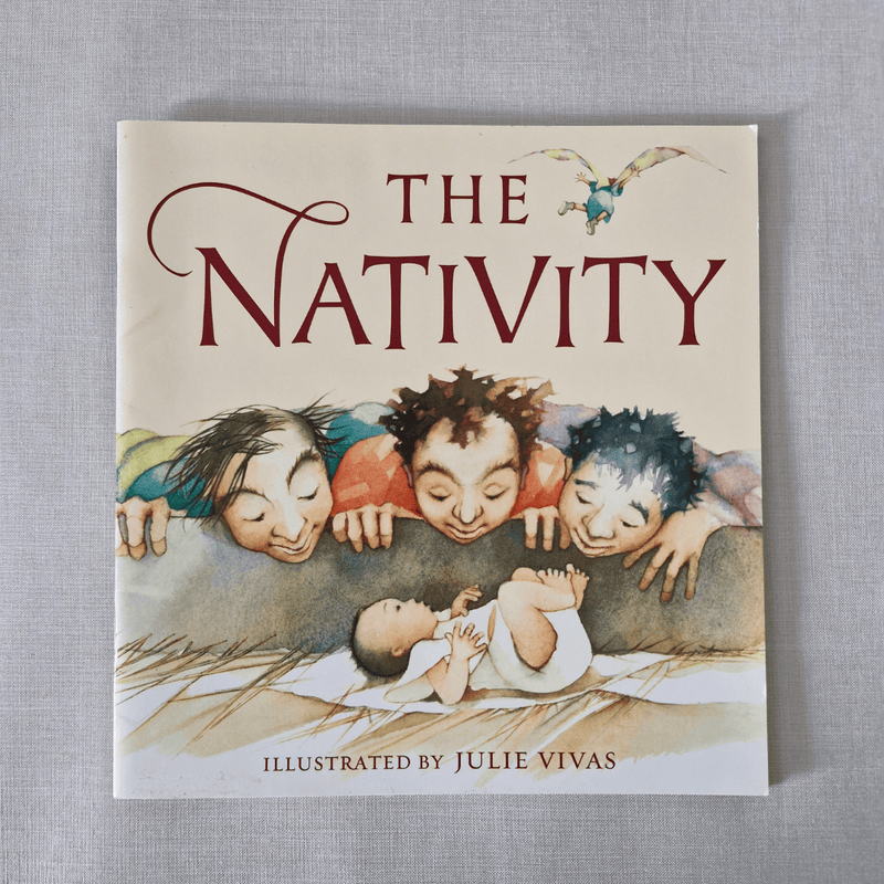 Book cover of 'The Nativity' with illustrations of children around a baby, on a grey background.