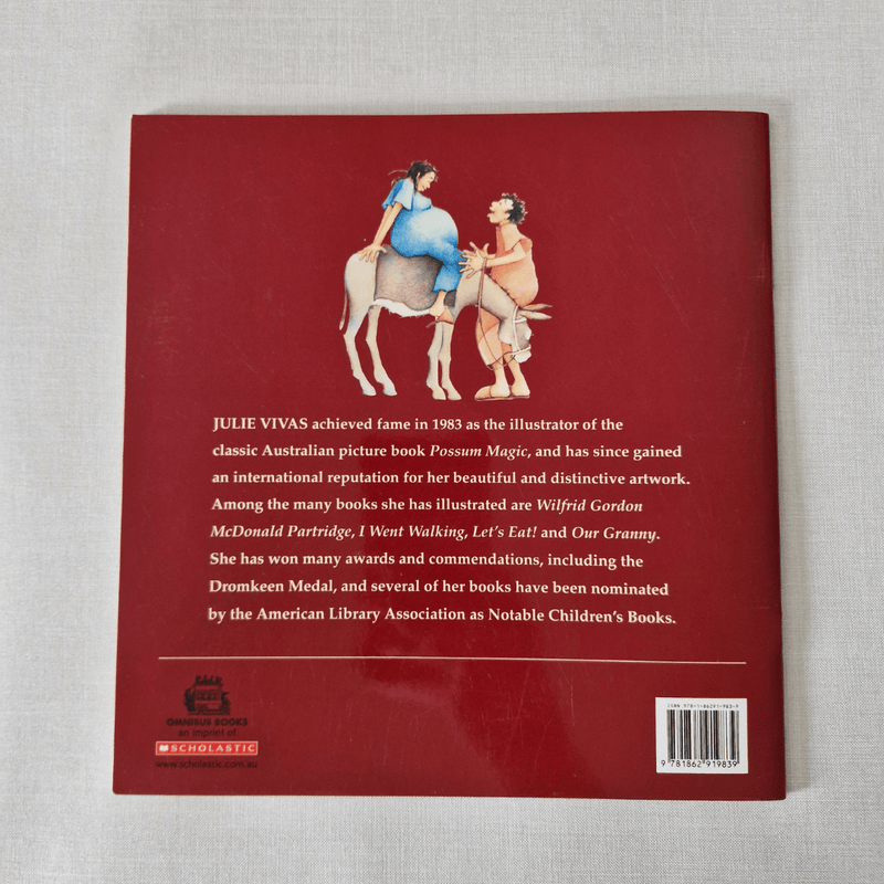 Book back cover with illustration of two figures on a donkey and text about Julie Vivas