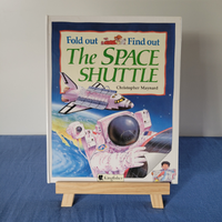 A children's book titled 'The Space Shuttle - Fold out and Find out' by Christopher Maynard, featuring illustrations of a space shuttle and an astronaut on the cover.