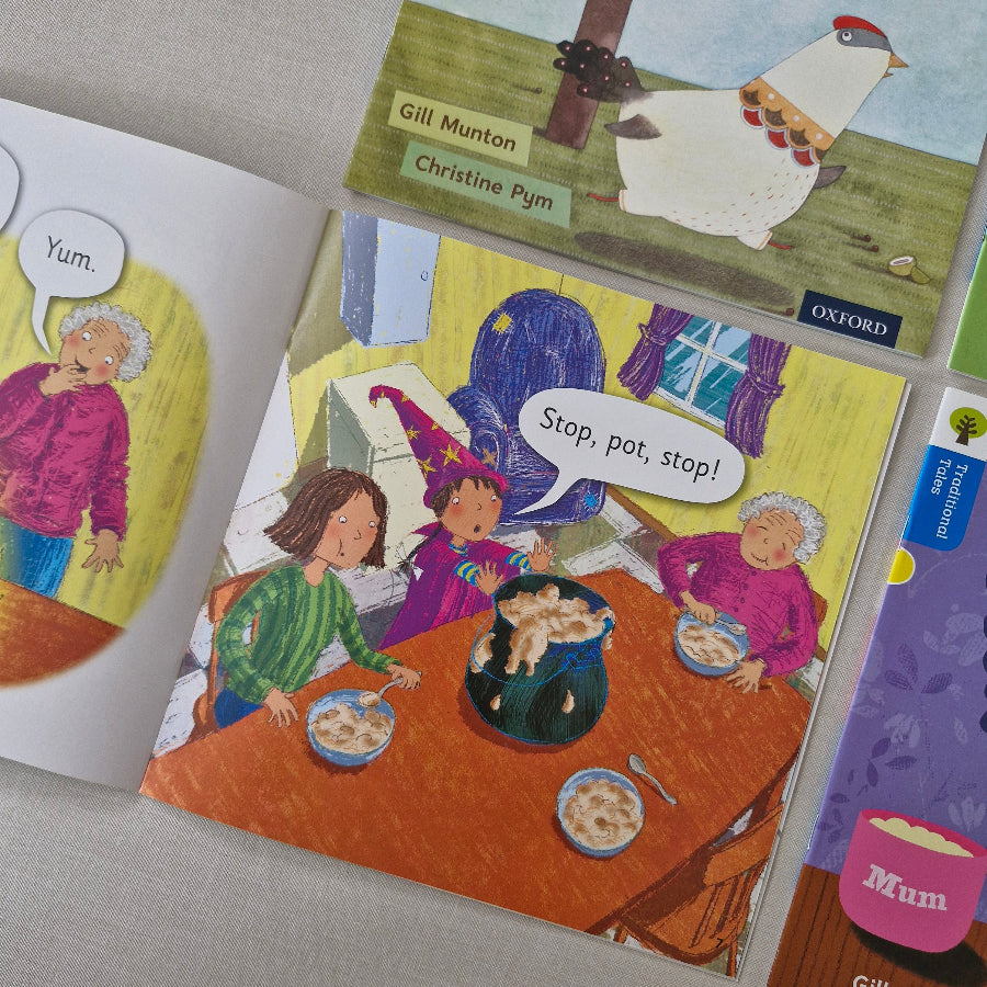 Children's books with colourful illustrations on a textured surface