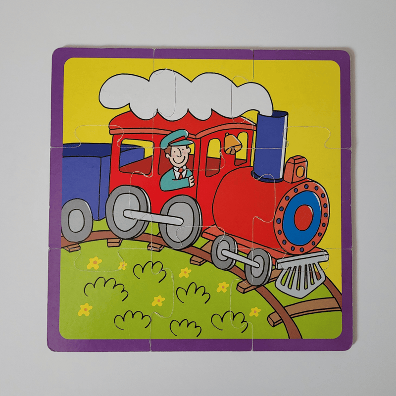 Children's puzzle with a red train on a yellow background