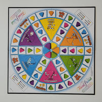 A colorful circular board game called 'Frida's Fun Party Game' featuring multiple vibrant segments with cartoon illustrations and text, presented on a light gray background.