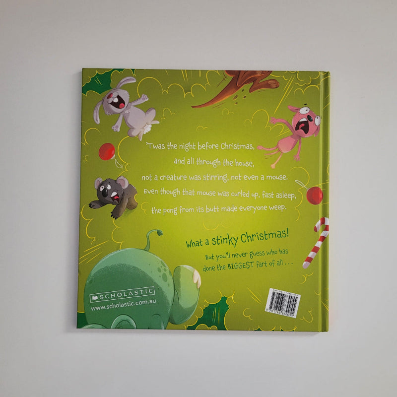 The back cover of a children's book titled 'Twas the Fart before Christmas' featuring a green background with cartoon illustrations of a pink Christmas tree, a white bunny, a dark gray dog, and red ornaments.