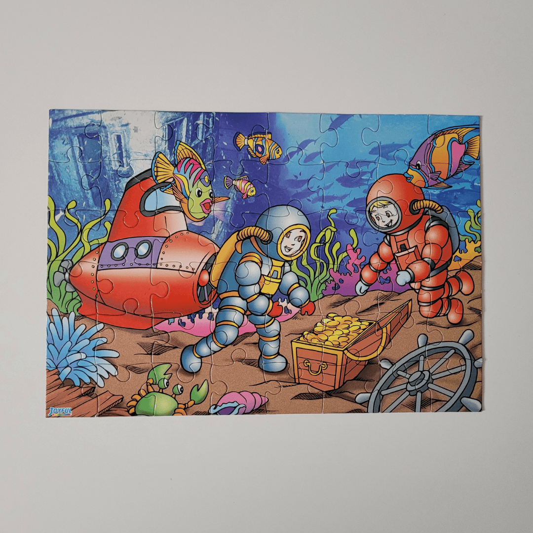 Children's puzzle with underwater scene featuring astronauts and a submarine.