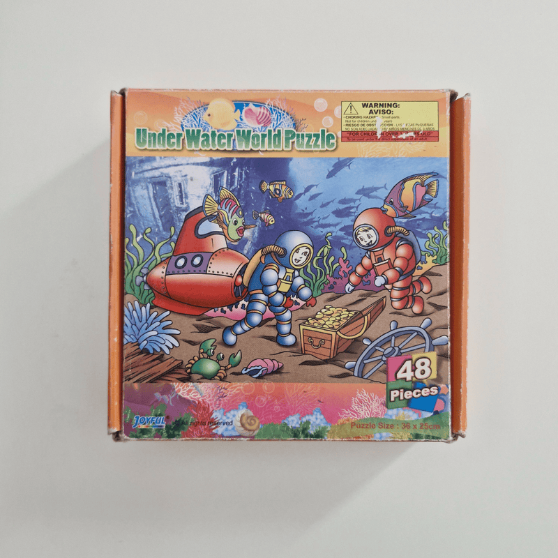 Box of 'Under Water World Puzzle' with underwater scene and puzzle pieces count on a light gray background