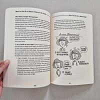Open book with illustrations on anger management and text on a gray fabric background