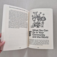 Open book with text and illustrations on a gray background