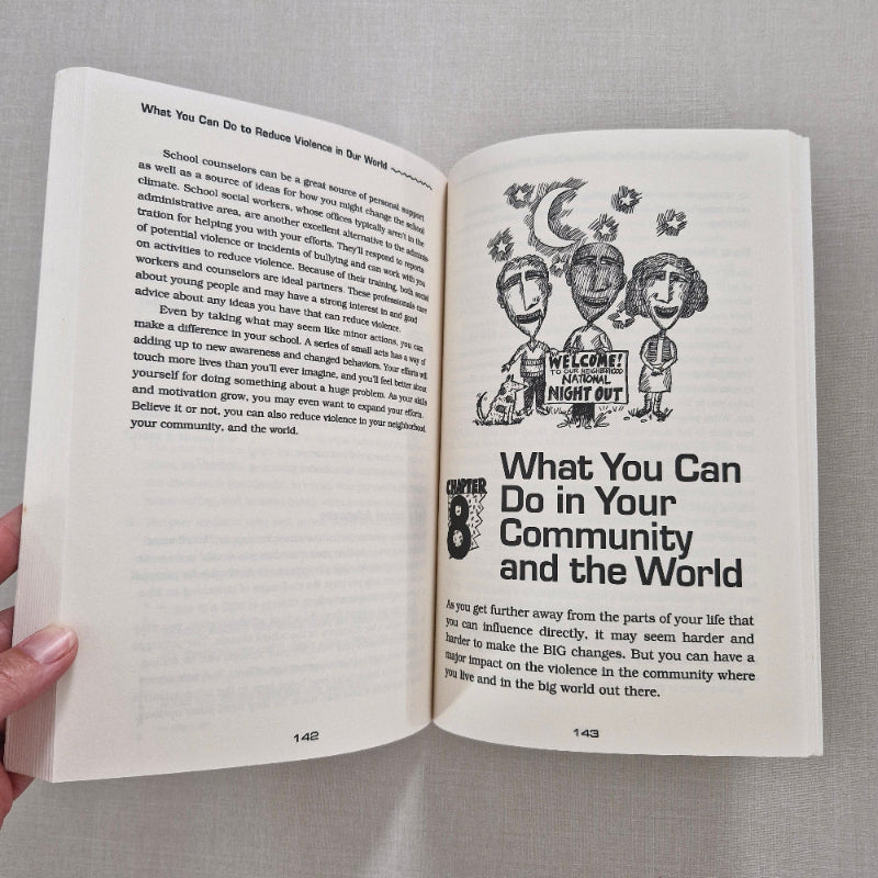 Open book with text and illustrations on a gray background