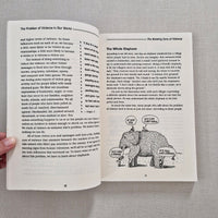 Open book with text and a black and white illustration on a gray background