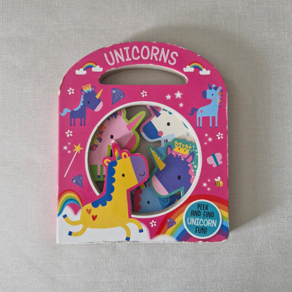 Children's book with colourful unicorn illustrations on a pink cover