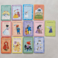 Set of fairy tale cards on a textured surface