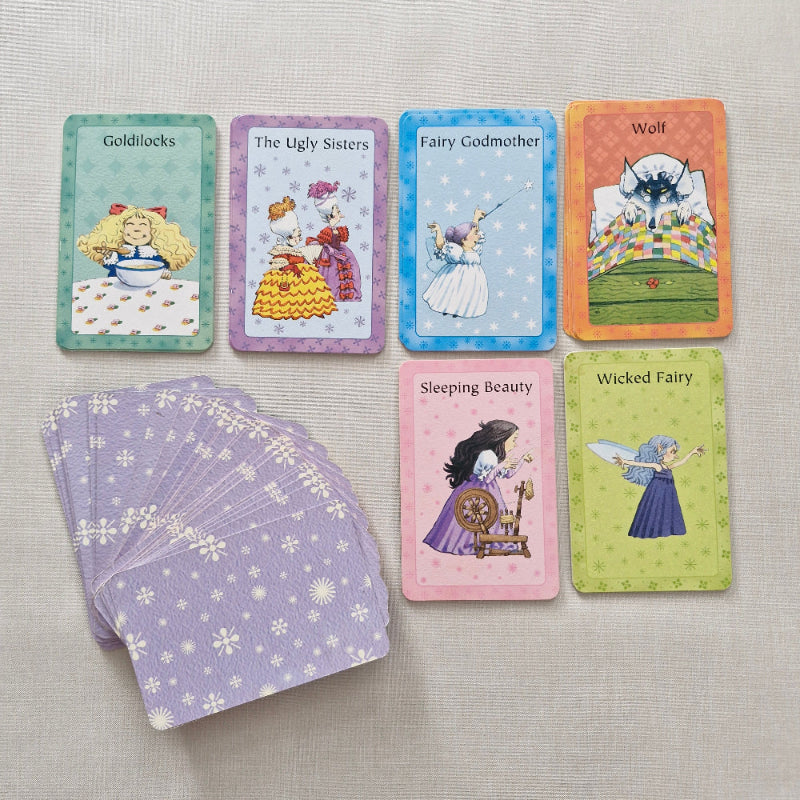 Set of fairy tale cards on a textured surface