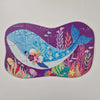 Colourful whale-shaped puzzle on a purple background