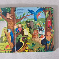 Children's book with colourful illustrations of animals and nature on a gray background