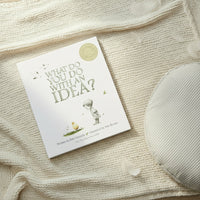 Book titled 'what do you do with an idea?' sitting on woollen blanket